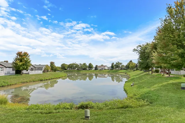 a view of a lake with houses in the back