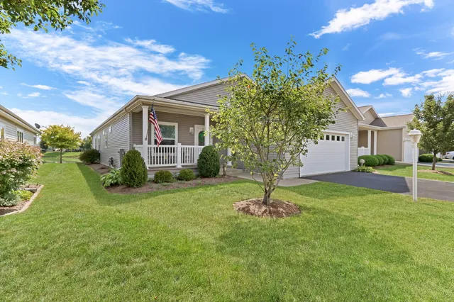 a view of a house with a backyard