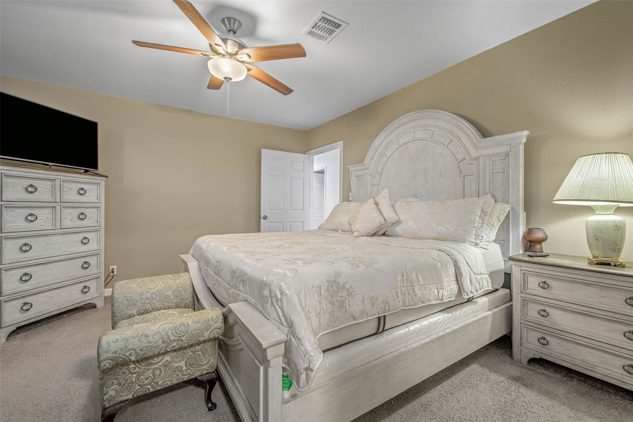 3876 Hummingbird Lane Bedias, TX 77831 - Photo 14 of 29 a bedroom with a bed and a flat screen tv