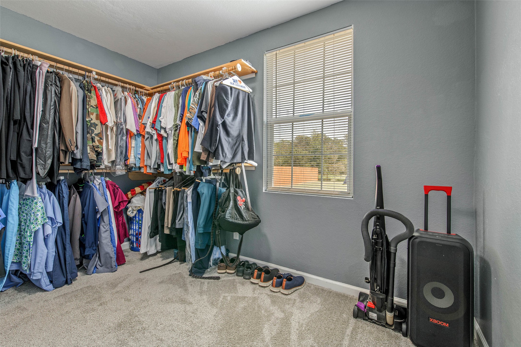 3876 Hummingbird Lane Bedias, TX 77831 - Photo 15 of 29 a view of walk in closet with clothes