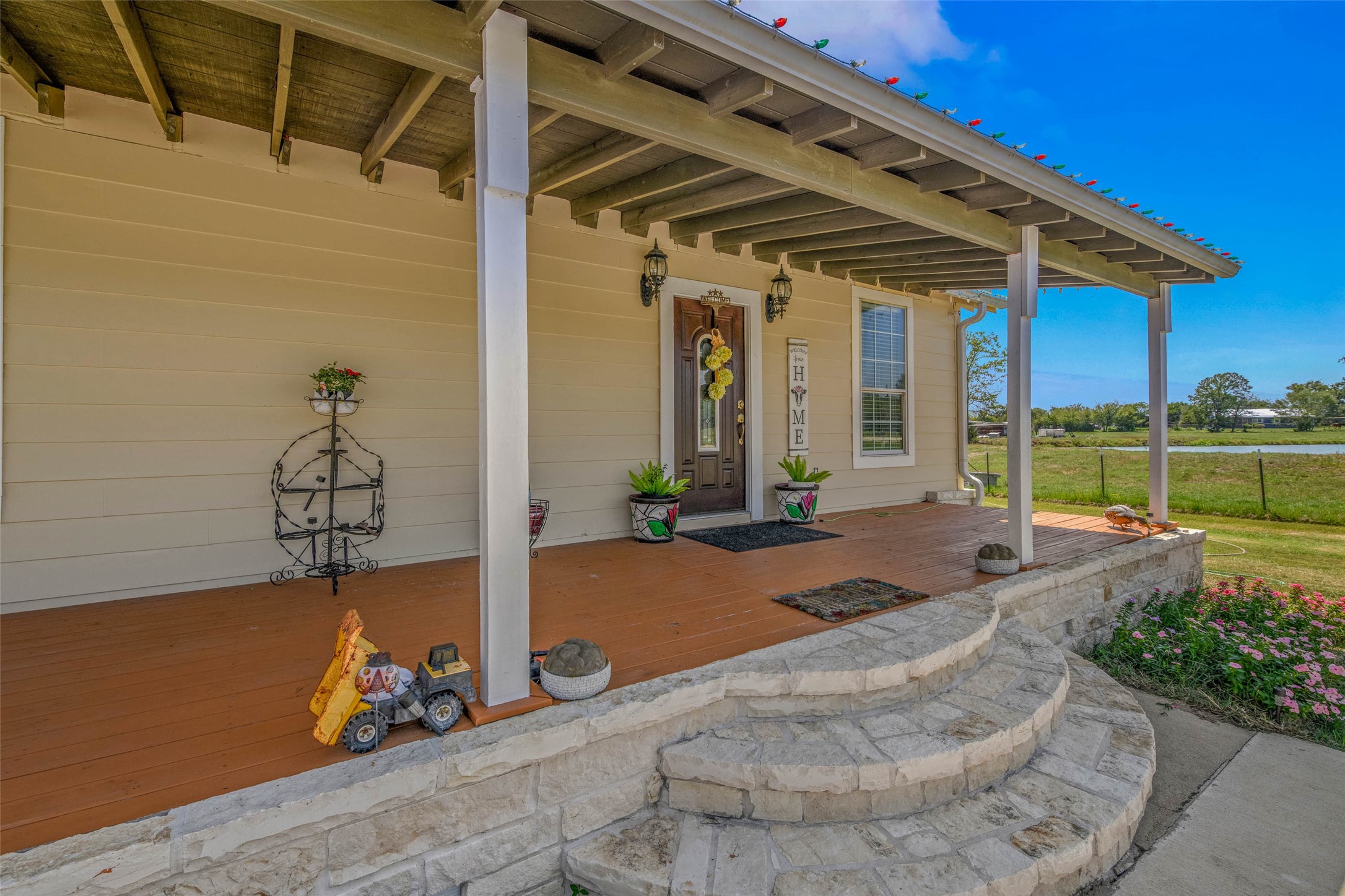 3876 Hummingbird Lane Bedias, TX 77831 - Photo 2 of 29 a front view of a house with garden