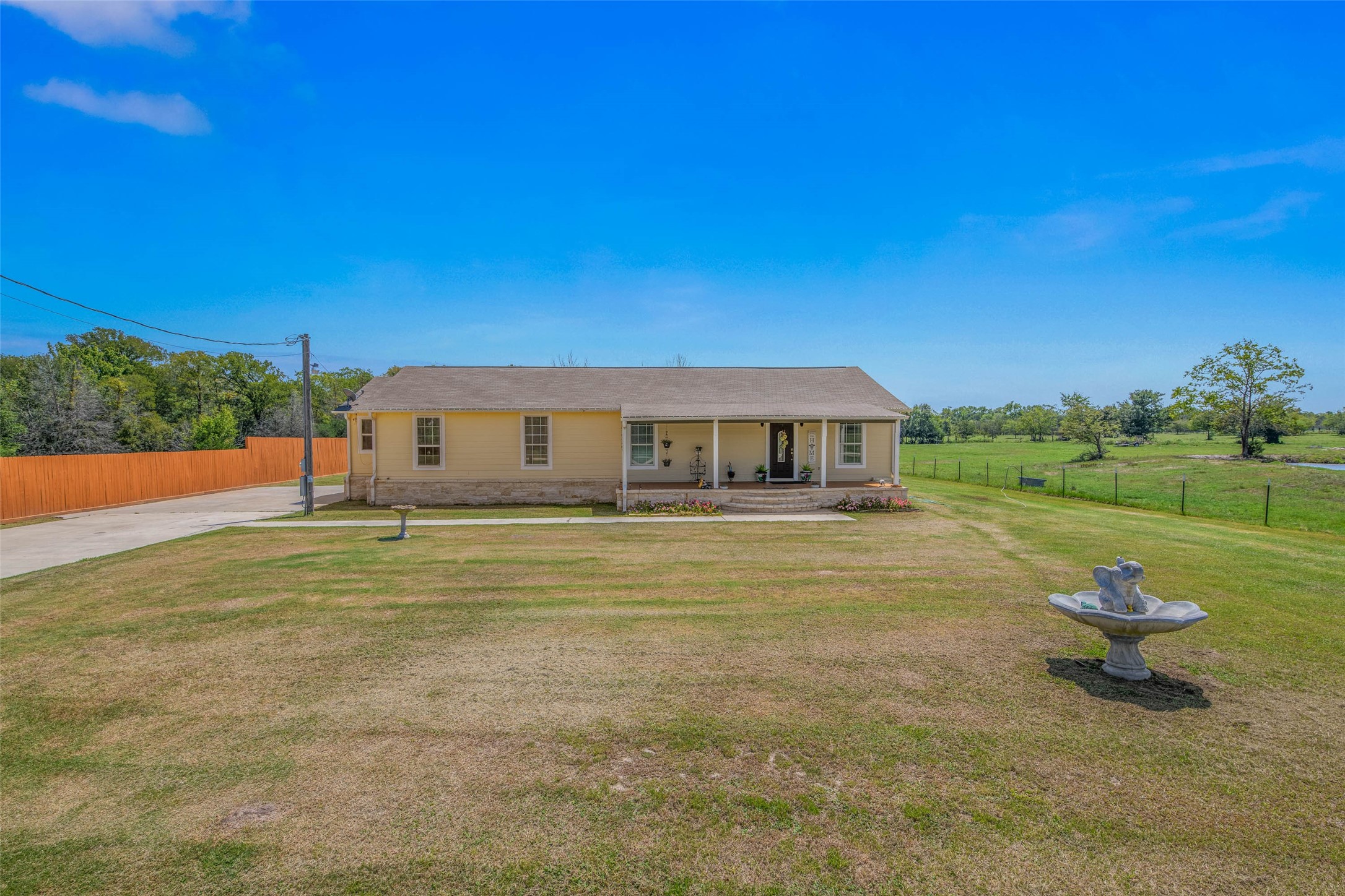 3876 Hummingbird Lane Bedias, TX 77831 - Photo 5 of 29 a front view of a house with a yard