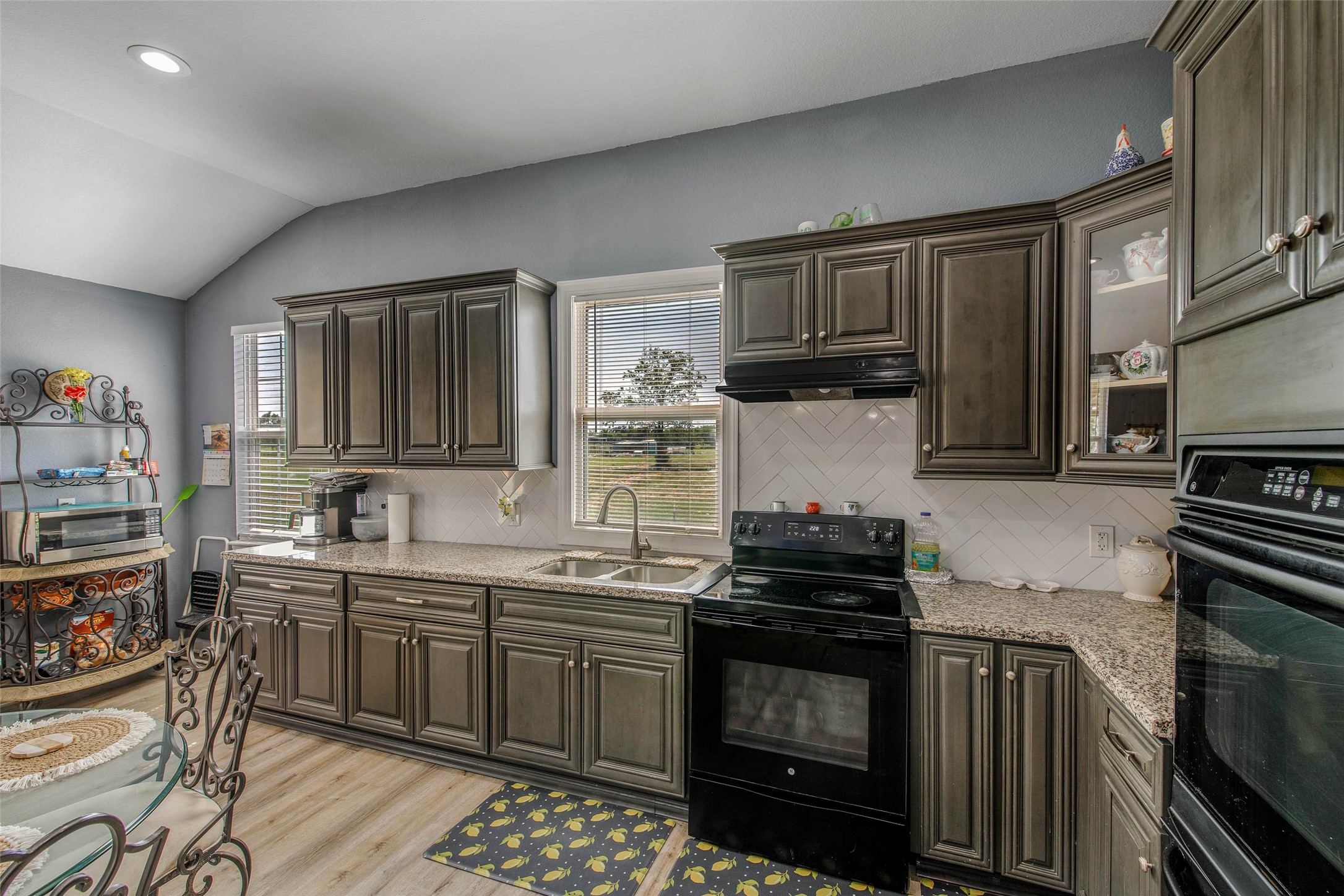 3876 Hummingbird Lane Bedias, TX 77831 - Photo 8 of 29 a kitchen with stainless steel appliances a sink stove and cabinets