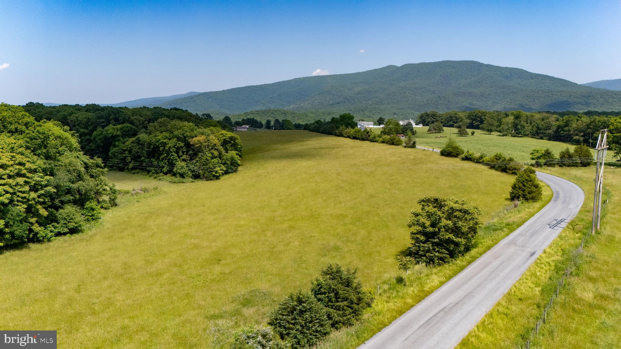 Off Sunnyview Drive Rileyville, VA 22650 - Photo 22 of 37 a view of a swimming pool with a table and chairs