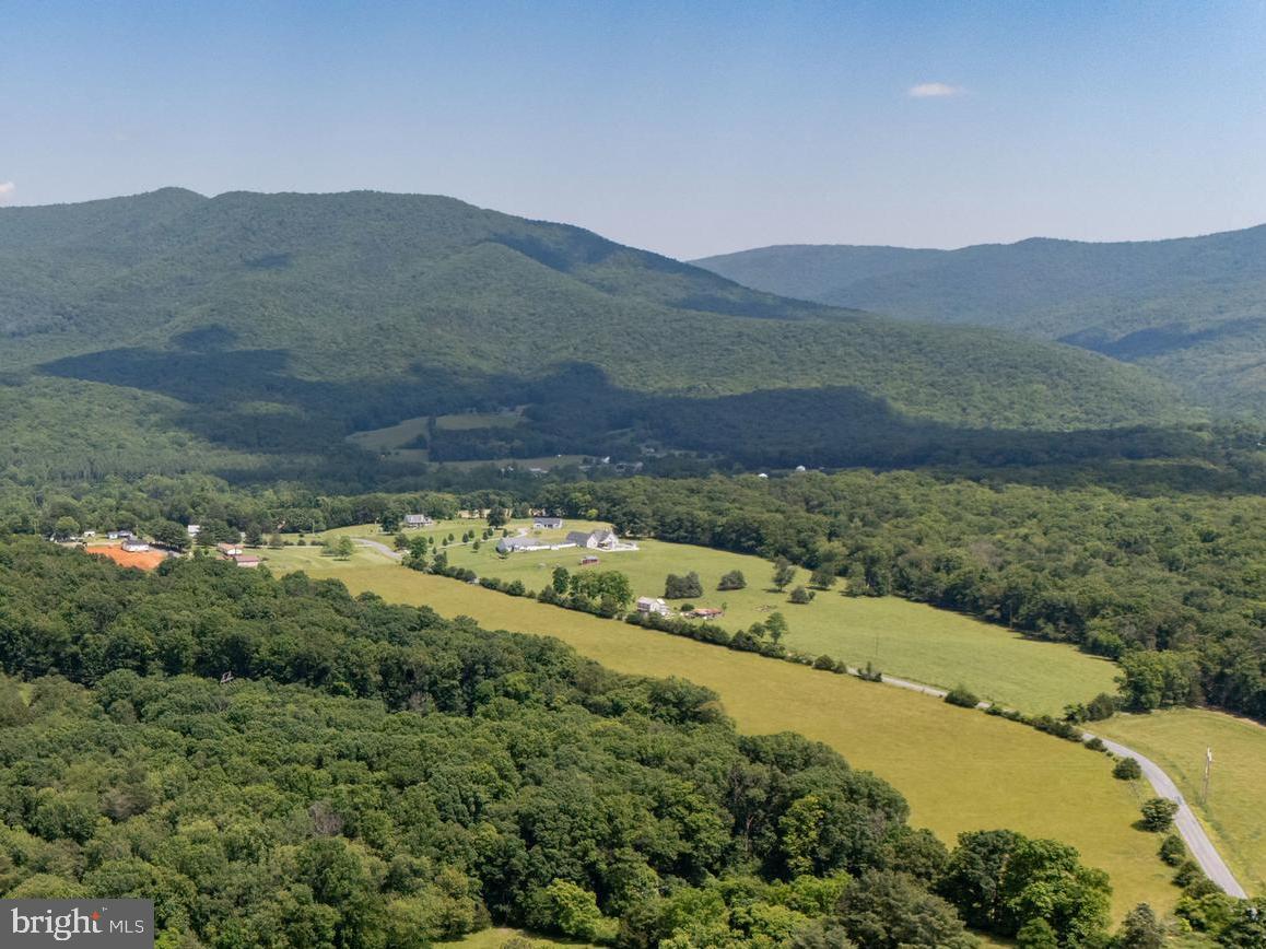 Off Sunnyview Drive Rileyville, VA 22650 - Photo 6 of 37 a view of a lush green hillside and houses