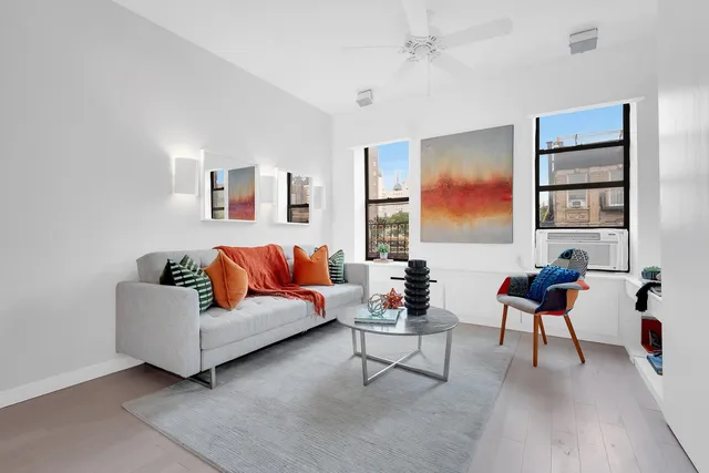 a living room with furniture and window