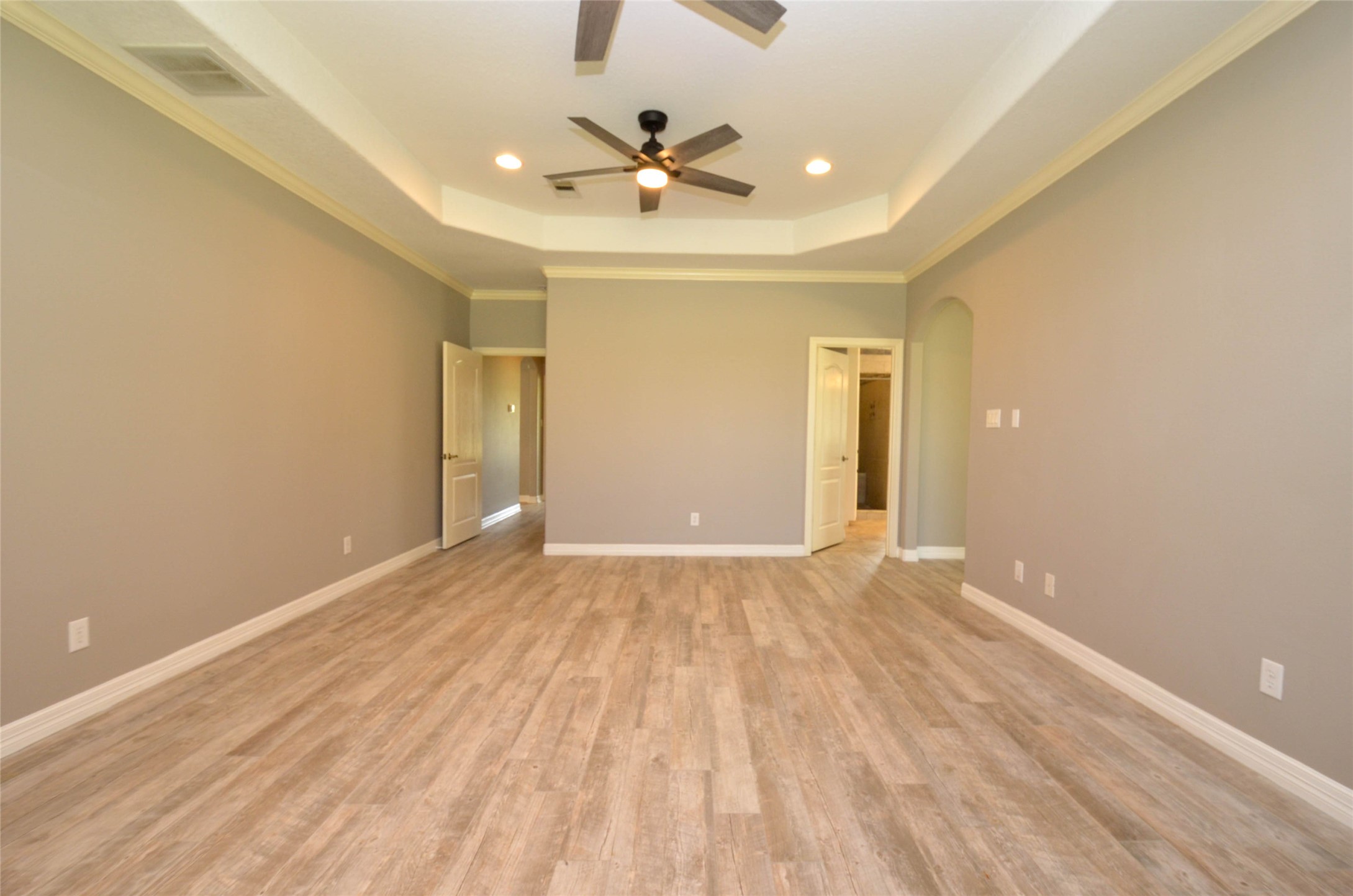 6125 Alleluia Trail Manvel, TX 77578 - Photo 13 of 25 a view of an empty room with a ceiling fan