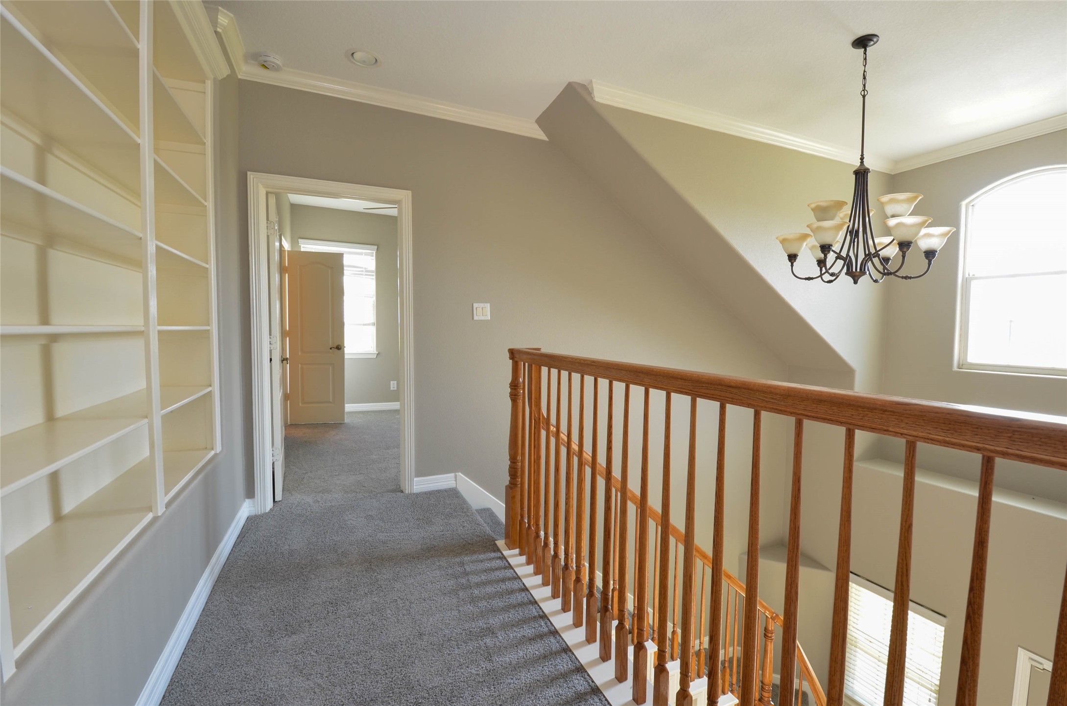 6125 Alleluia Trail Manvel, TX 77578 - Photo 18 of 25 a view of a hallway with a chandelier
