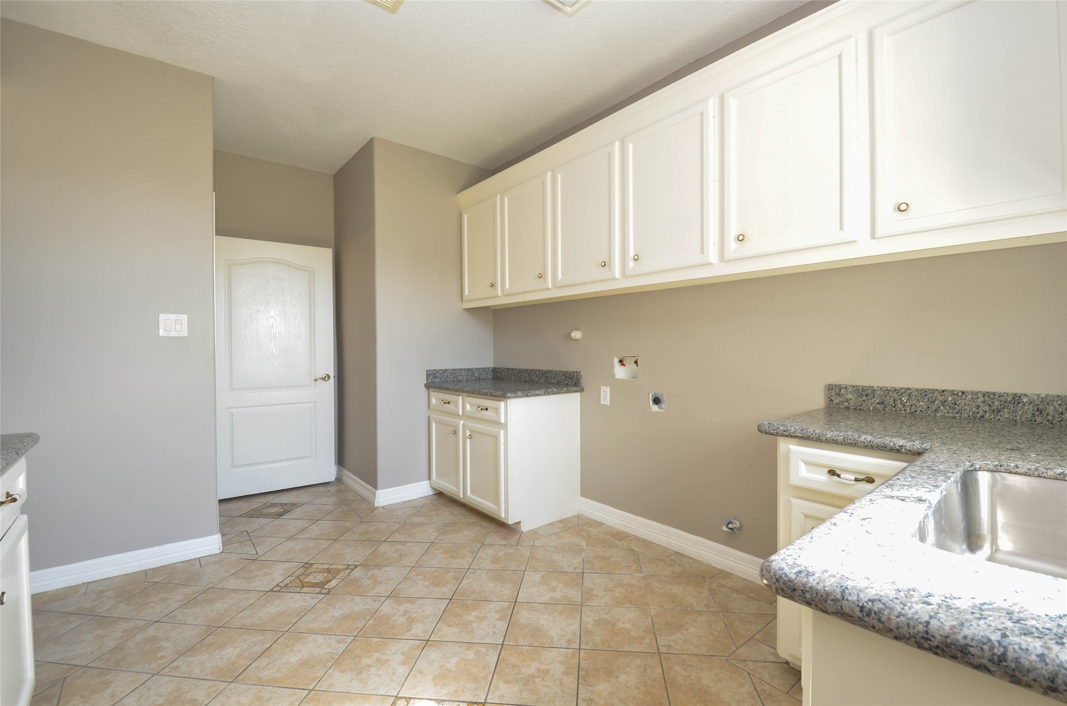 6125 Alleluia Trail Manvel, TX 77578 - Photo 22 of 25 a kitchen with granite countertop a sink a stove and cabinets