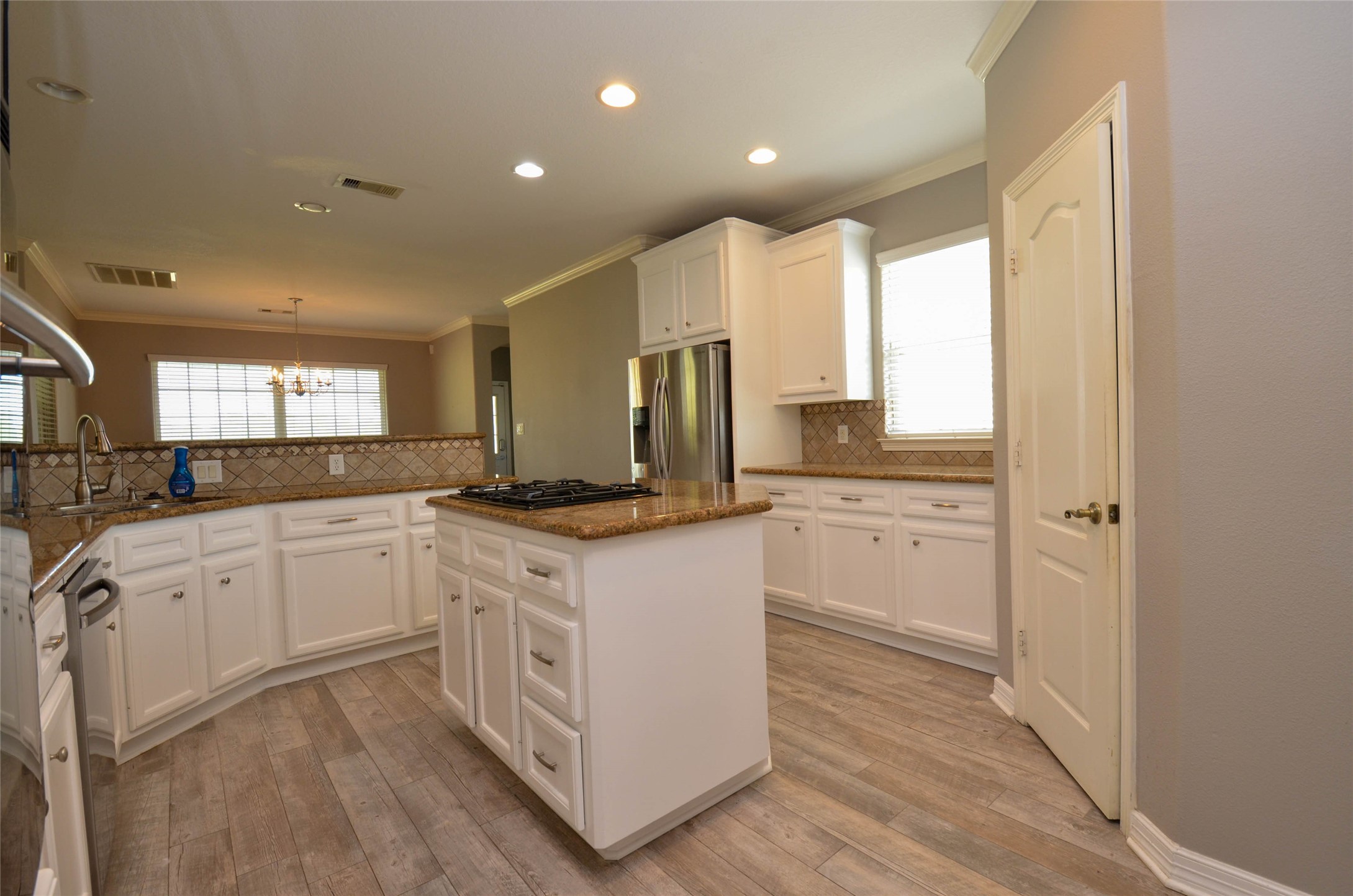 6125 Alleluia Trail Manvel, TX 77578 - Photo 4 of 25 a kitchen with white cabinets and white appliances
