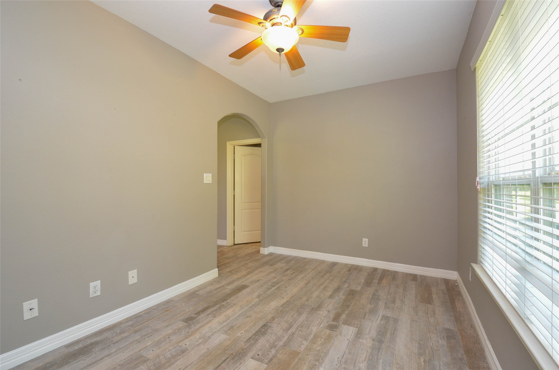 6125 Alleluia Trail Manvel, TX 77578 - Photo 7 of 25 wooden floor in an empty room with a window