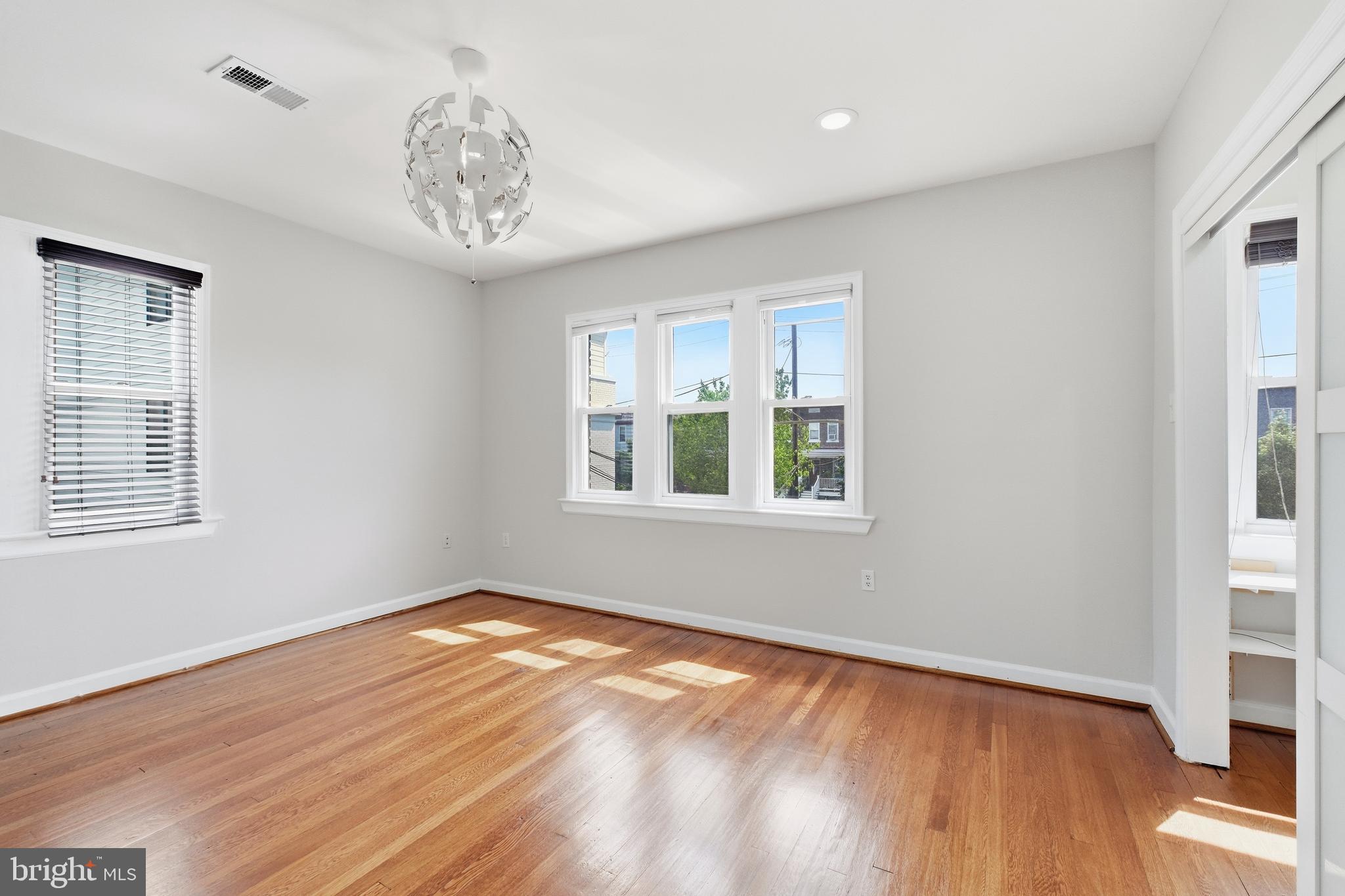 2712 6th Street Northeast Washington, DC 20017 - Photo 13 of 24 a view of an empty room with wooden floor and a window