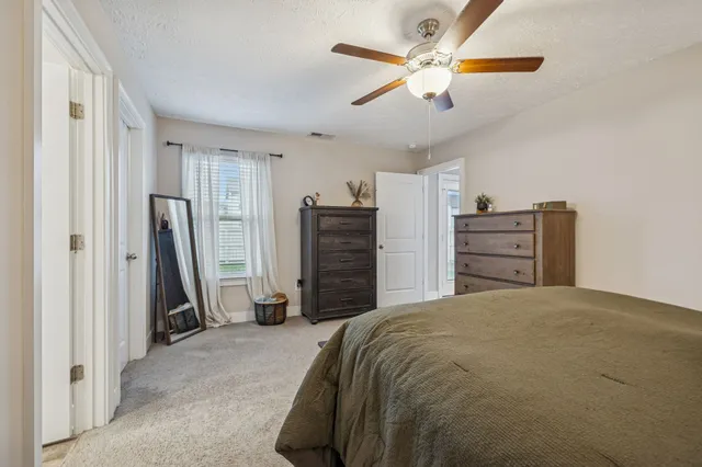 a bedroom with a bed and a closet