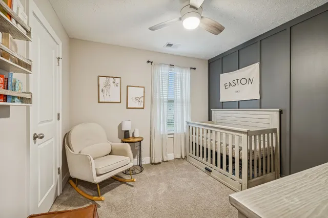 a bedroom with furniture and a window