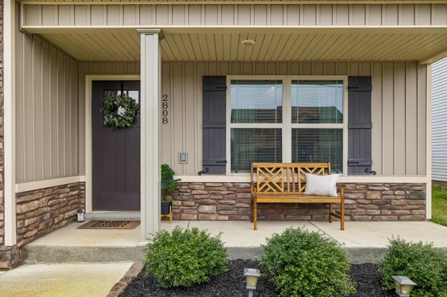 a front view of a house with garden