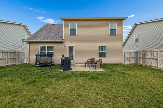 a backyard of a house with seating space