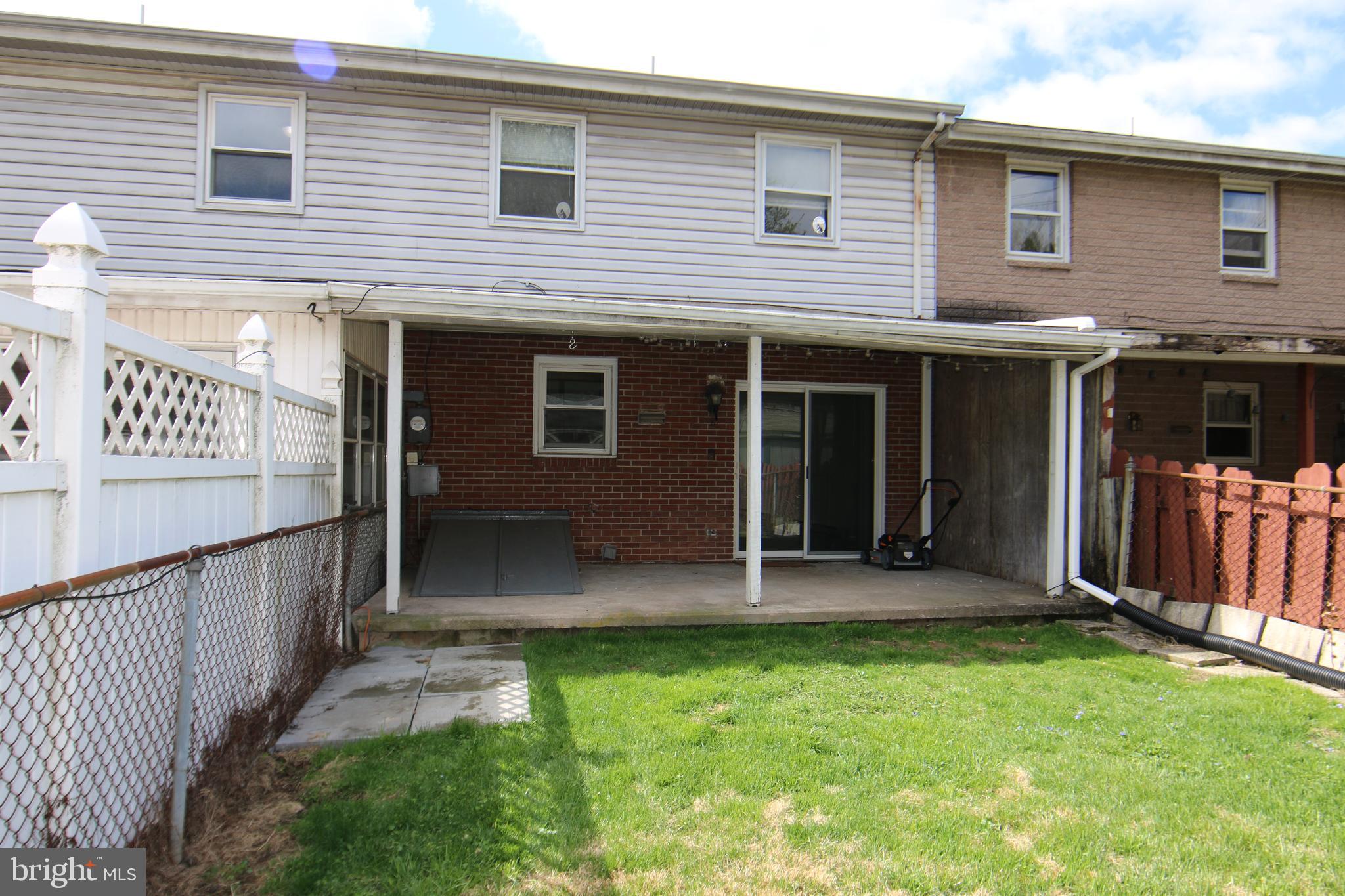 2121 Market St Extension Middletown, PA 17057 - Photo 18 of 19 a view of a house with wooden fence and a yard