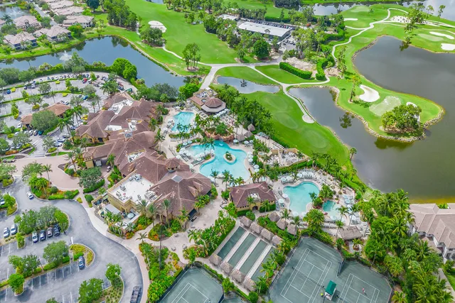an aerial view of a residential houses with outdoor space