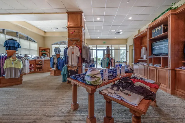 a living room with lots of furniture and gym equipment
