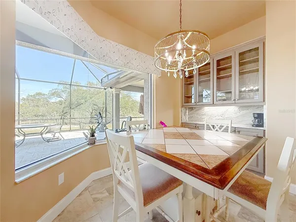 a kitchen with stainless steel appliances granite countertop a refrigerator and a stove