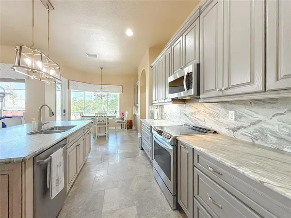 a large bathroom with a granite countertop sink mirror and a