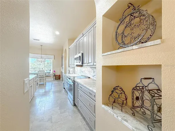 a spacious bathroom with a granite countertop sink and a mirror