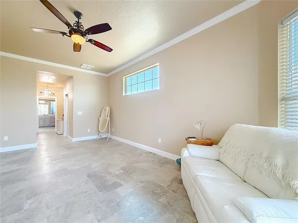 a utility room with granite countertop cabinets washer and dryer