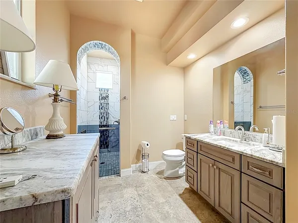 a view of a patio with a table and chairs under an umbrella