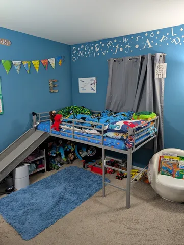 a bedroom with furniture and a bed