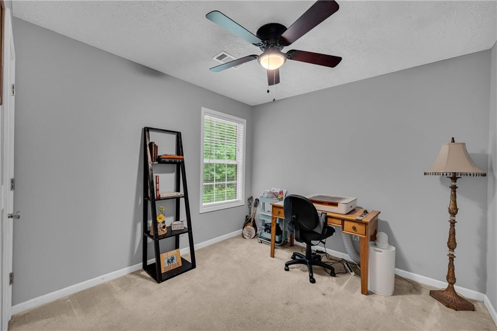 587-j B J B Owens Road Bethlehem, GA 30620 - Photo 47 of 99 a view of a workspace with furniture and a window