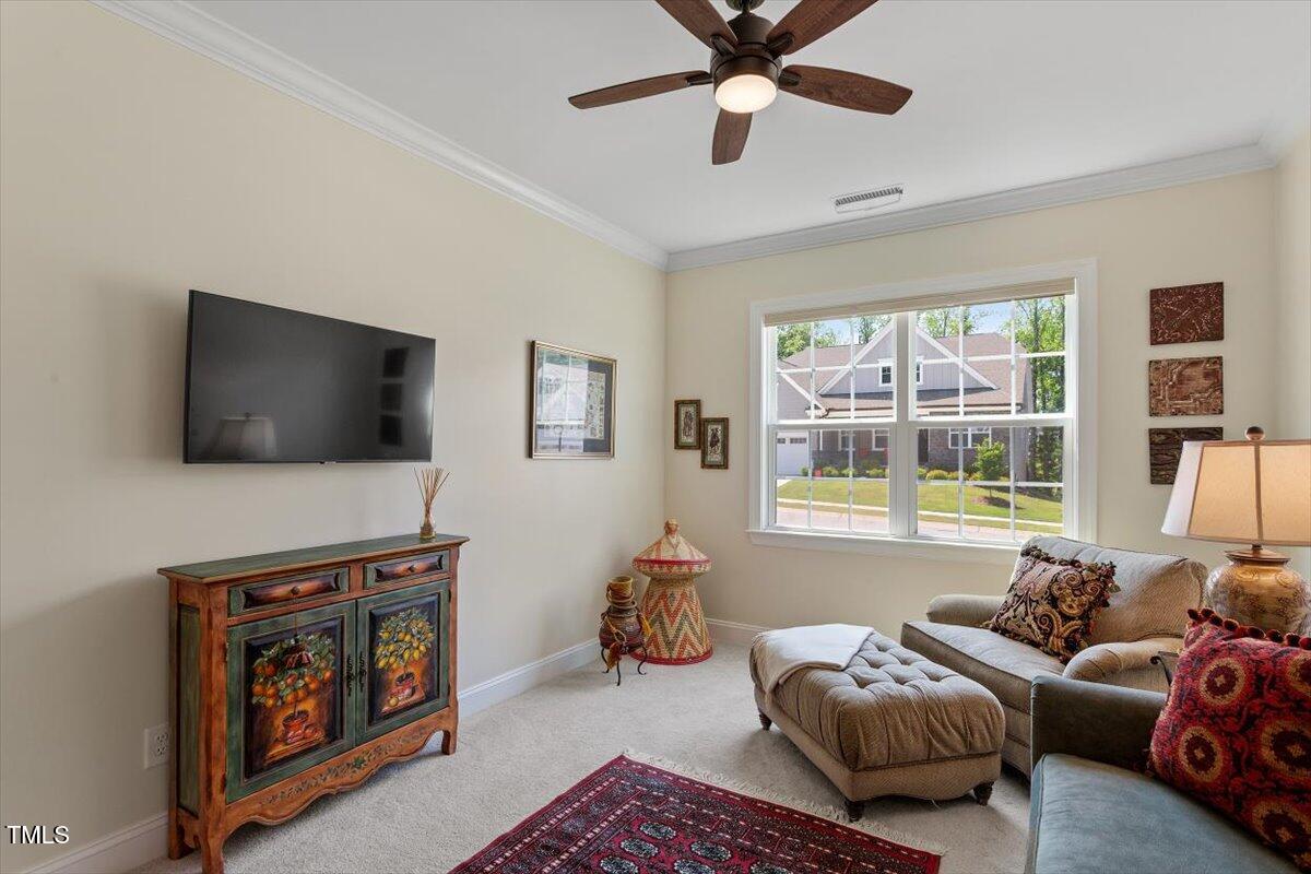 131 English Violet Lane Raleigh, NC 27610 - Photo 29 of 45 a living room with furniture and a flat screen tv