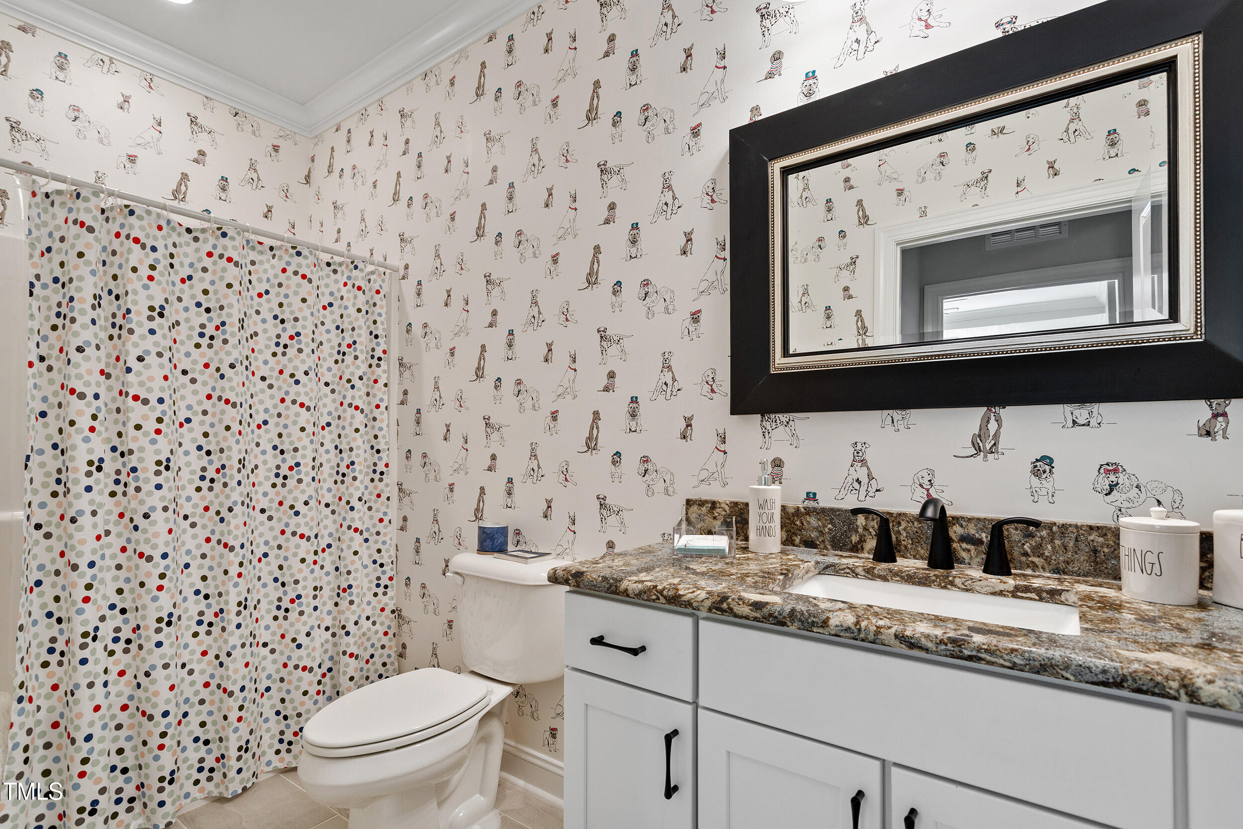 131 English Violet Lane Raleigh, NC 27610 - Photo 31 of 45 a bathroom with a granite countertop toilet sink and mirror