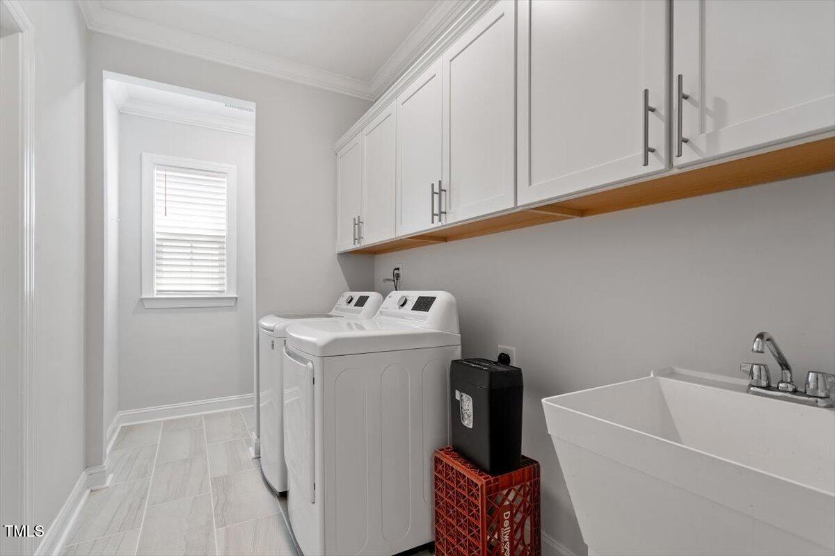 131 English Violet Lane Raleigh, NC 27610 - Photo 32 of 45 a utility room with dryer and washer
