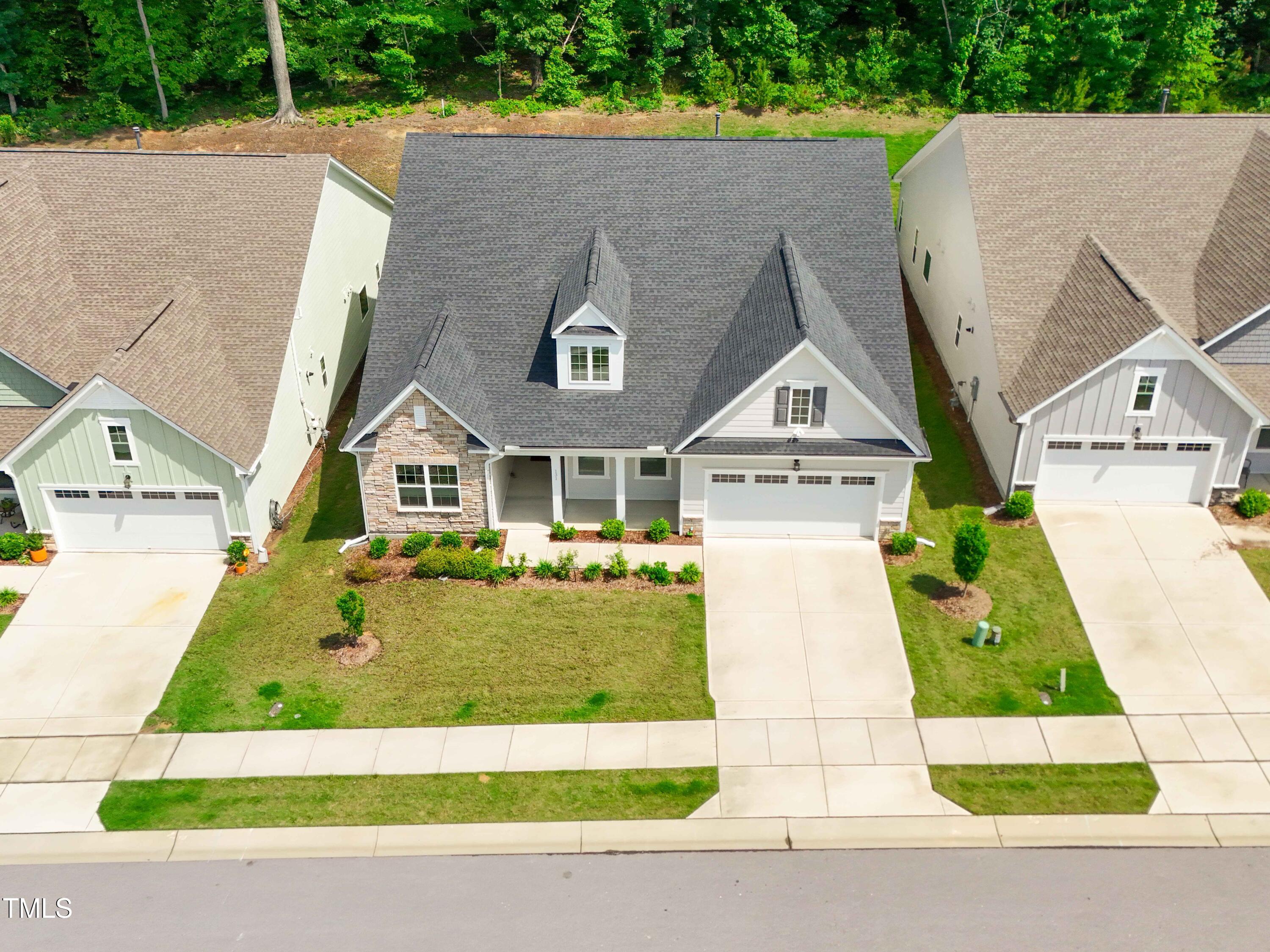 131 English Violet Lane Raleigh, NC 27610 - Photo 36 of 45 a view of multiple houses with a yard