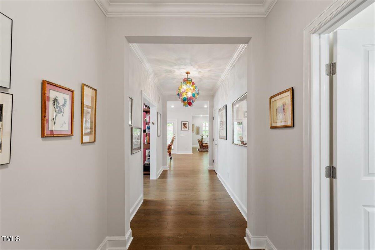 131 English Violet Lane Raleigh, NC 27610 - Photo 4 of 45 a view of a hallway with wooden floor and windows
