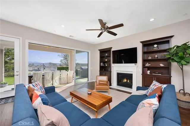 a living room with furniture fireplace and a flat screen tv
