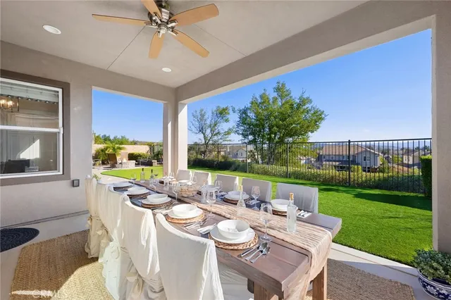 a dinning table and chairs in the garden