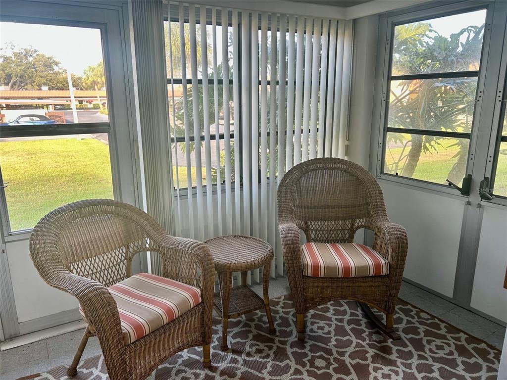 1701 Pinehurst Road, Unit 18C Dunedin, FL 34698 - Photo 7 of 17 a living room with furniture and a window
