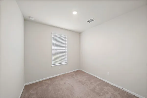 a view of a room that has a window in it