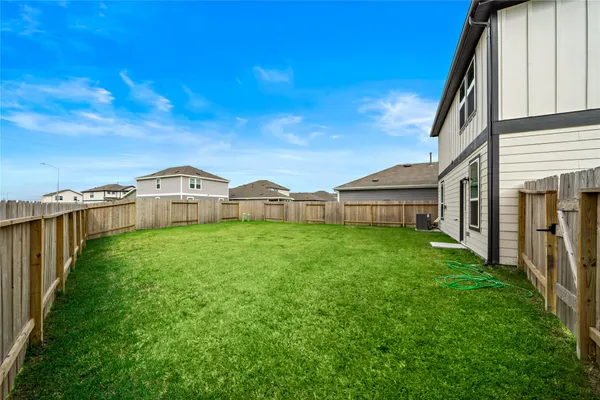 a view of a house with backyard and porch