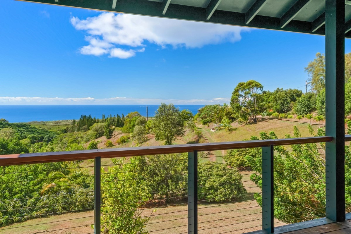 1613 Puu Road, Unit B Kalaheo, HI 96741 - Photo 12 of 27 a view of a glass door with a balcony