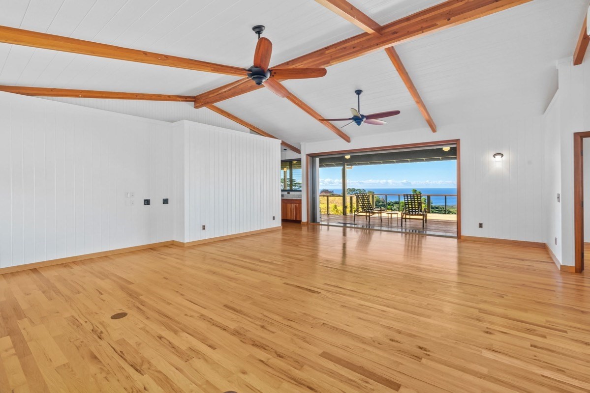 1613 Puu Road, Unit B Kalaheo, HI 96741 - Photo 13 of 27 a view of empty room with wooden floor and fan