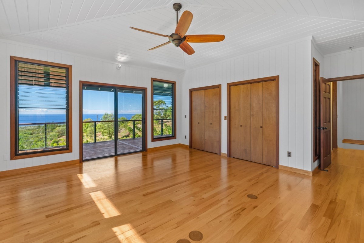 1613 Puu Road, Unit B Kalaheo, HI 96741 - Photo 15 of 27 a view of empty room with wooden floor and fan