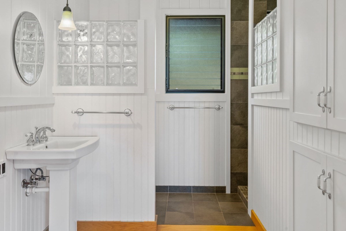 1613 Puu Road, Unit B Kalaheo, HI 96741 - Photo 16 of 27 a bathroom with a sink and a mirror