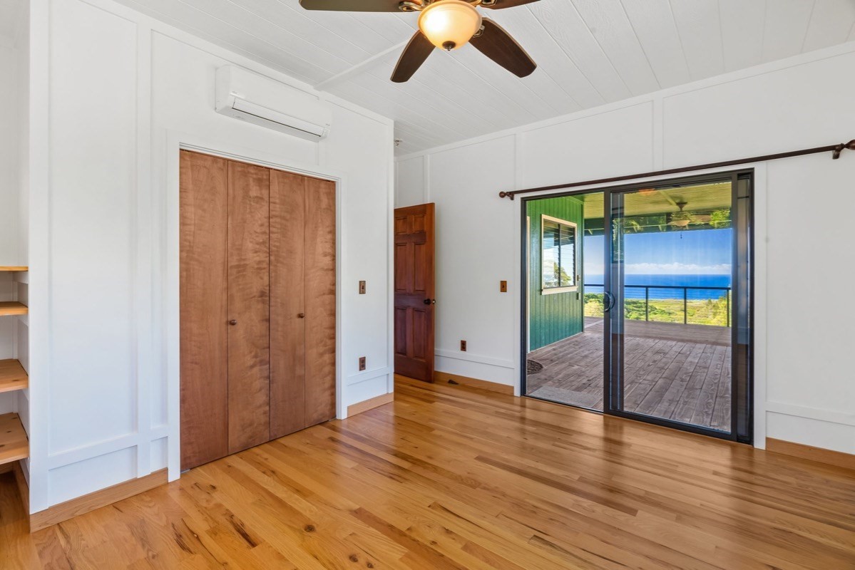 1613 Puu Road, Unit B Kalaheo, HI 96741 - Photo 19 of 27 wooden floor in an empty room with a window