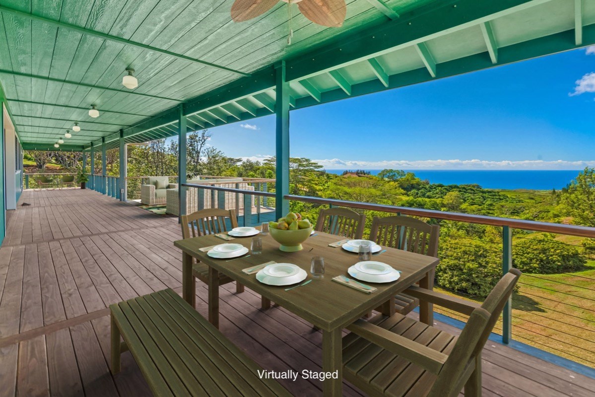 1613 Puu Road, Unit B Kalaheo, HI 96741 - Photo 2 of 27 a view of a balcony with furniture and wooden floor