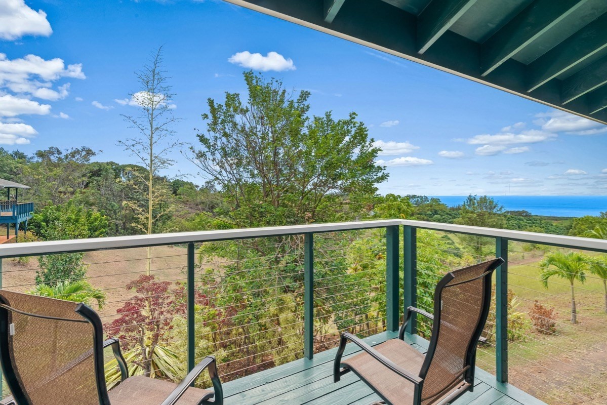 1613 Puu Road, Unit B Kalaheo, HI 96741 - Photo 25 of 27 a view of a balcony with chairs