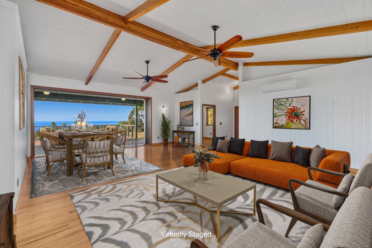 1613 Puu Road, Unit B Kalaheo, HI 96741 - Photo 5 of 27 a living room with furniture a rug and a ceiling fan