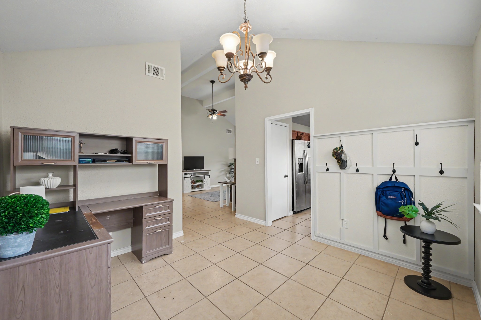 5226 Clarkston Lane Spring, TX 77379 - Photo 16 of 25 Bright and welcoming functional space complemented by a stylish chandelier and convenient wall hooks for storage.