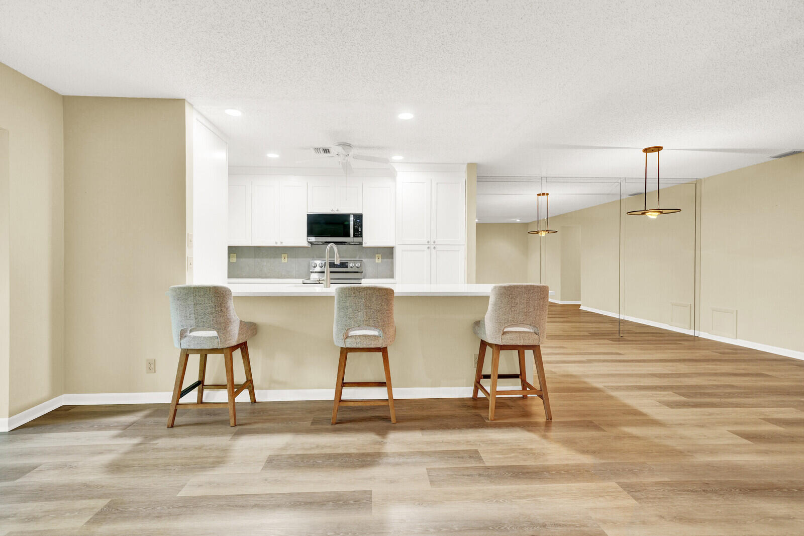 5270 Nesting Way, Unit C Delray Beach, FL 33484 - Photo 14 of 38 a view of kitchen with microwave and cabinets